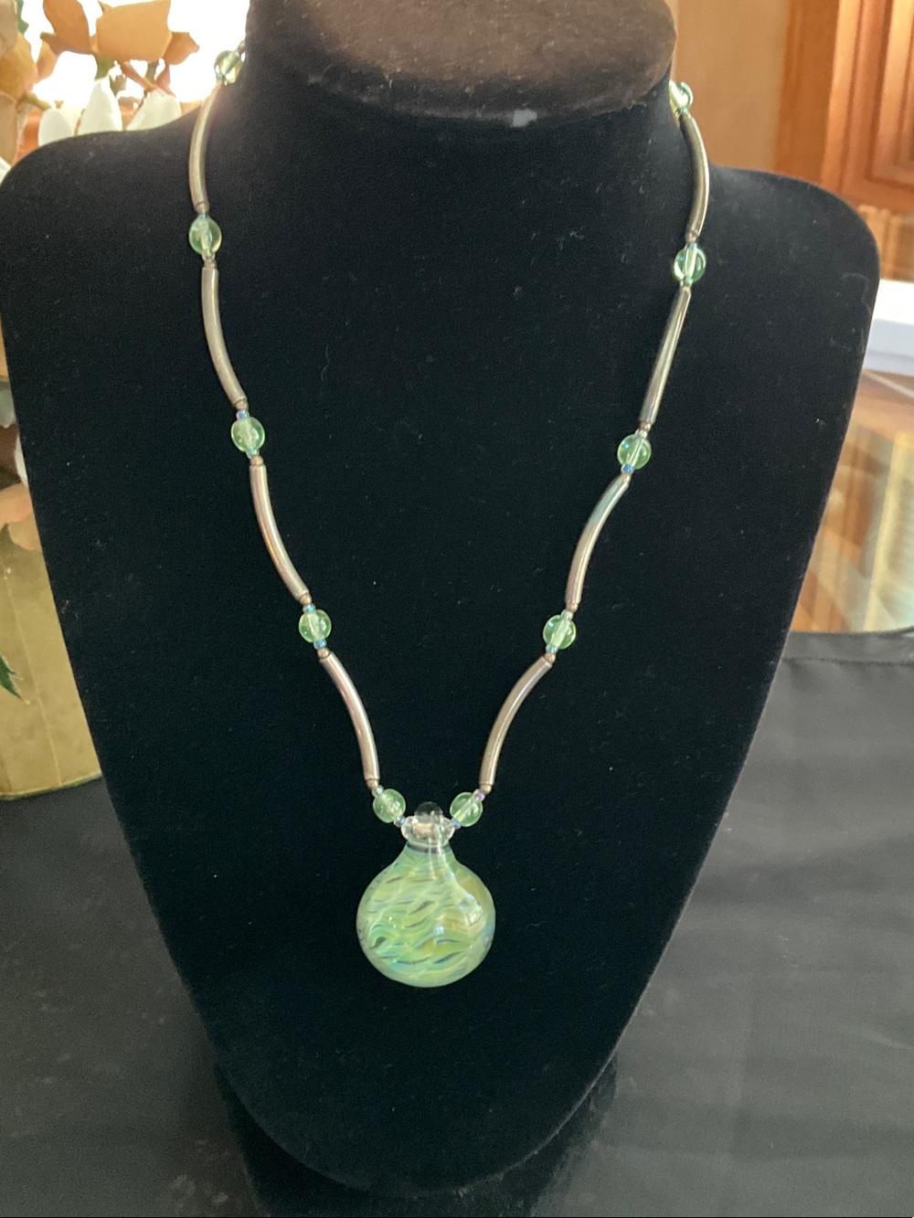 Iridescent Green Glass Pendant Necklace with Silver Accents